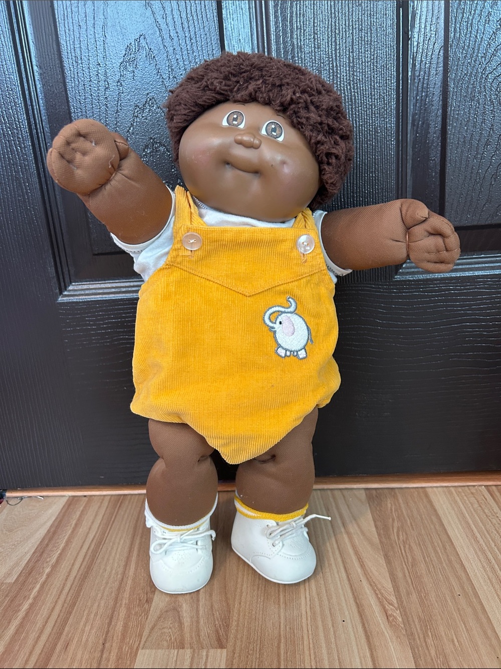Plush Brown Vinyl Doll in Yellow Corduroy Overalls